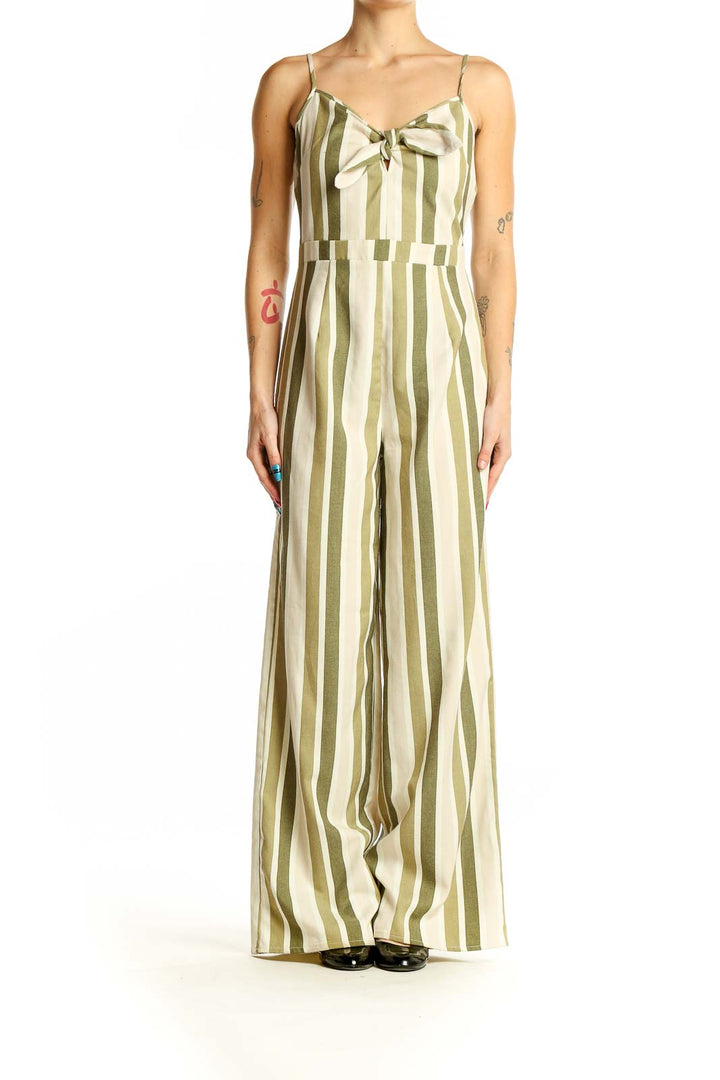 Front view of green and cream striped wide-leg jumpsuit with bow detail