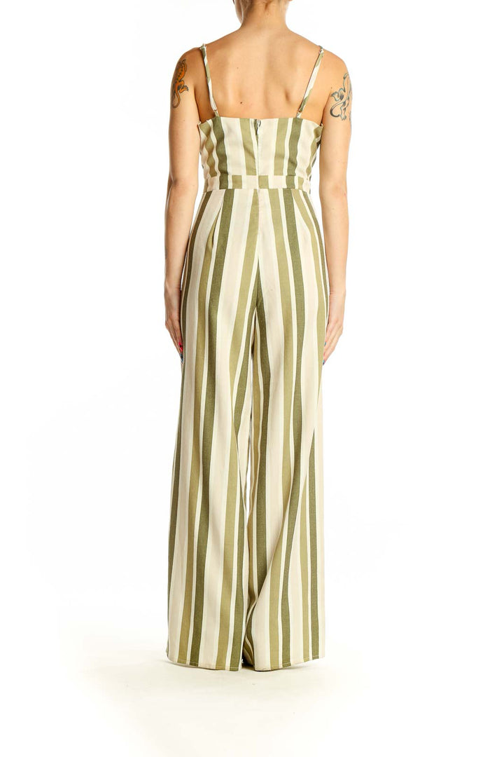 Side view of green and cream striped wide-leg jumpsuit showing full length