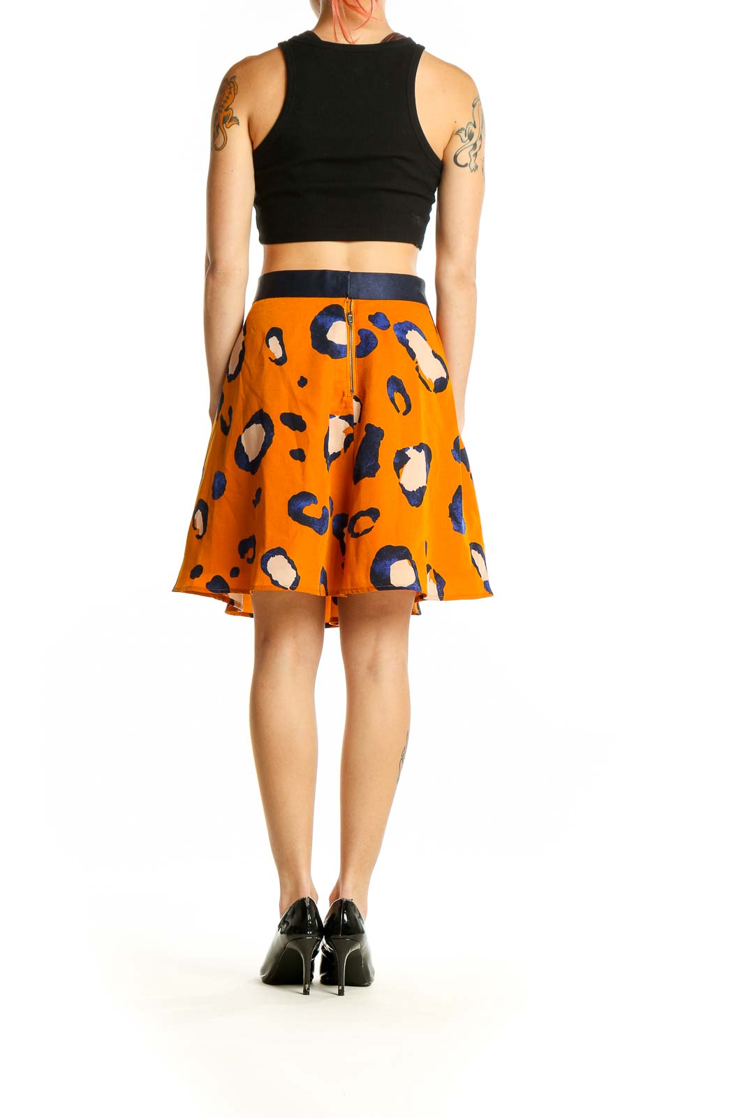 Side view of 3.1 Phillip Lim orange leopard print A-line skirt with black top