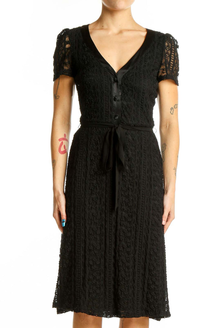 Front view of Betsy Johnson black lace midi dress with V-neck and button-front