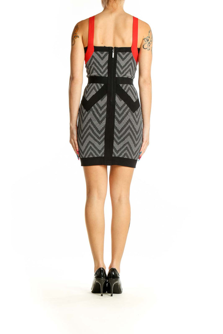 Back view of MARCIANO black and gray chevron bodycon dress showing red straps