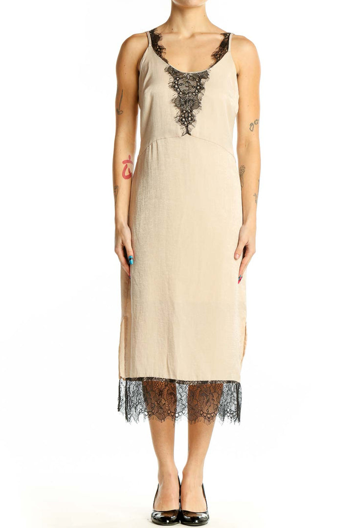 Front view of beige RESERVED midi slip dress with black lace trim