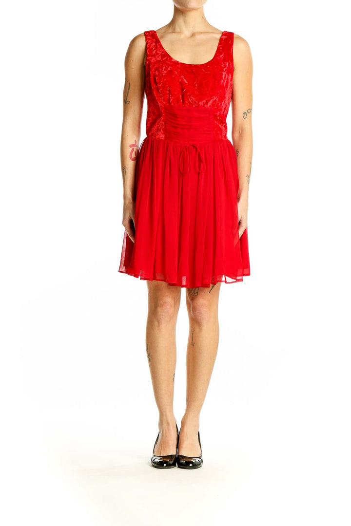 Front view of red Free People cocktail dress with lace bodice and chiffon skirt