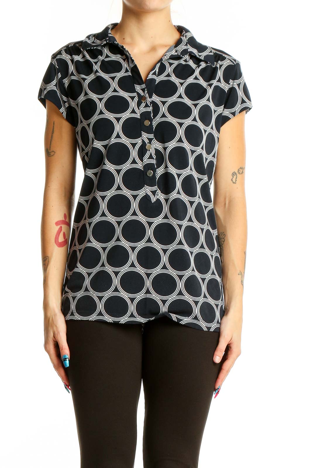 Front view of Alfani black and white geometric print polo top