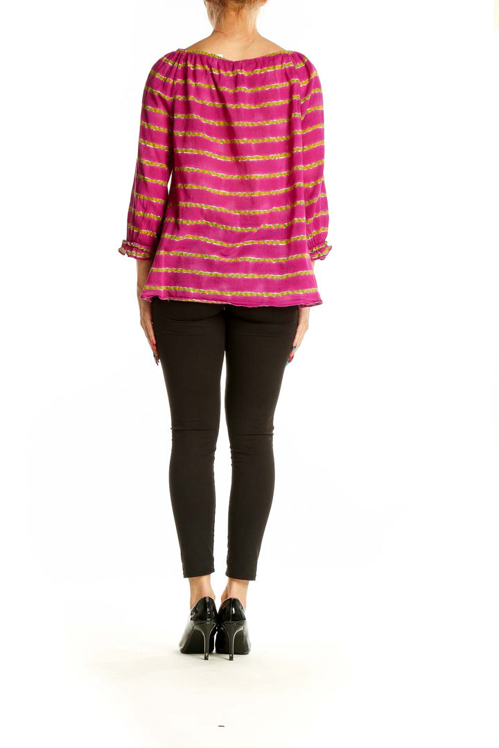 Side view of pink and yellow striped off-shoulder peasant top by Lauren Ralph Lauren on model