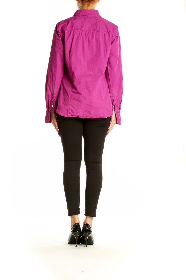 Back view of magenta J.Crew button-down shirt on model with black pants