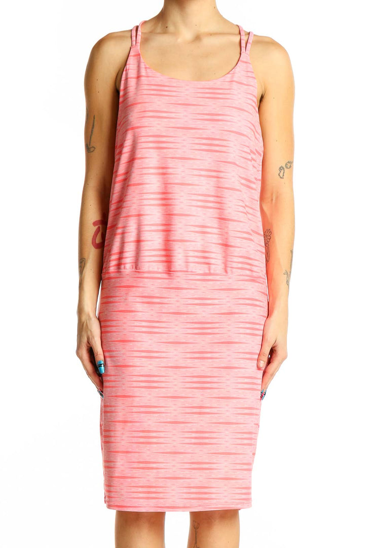 Front view of pink striped Athleta athletic dress with layered design