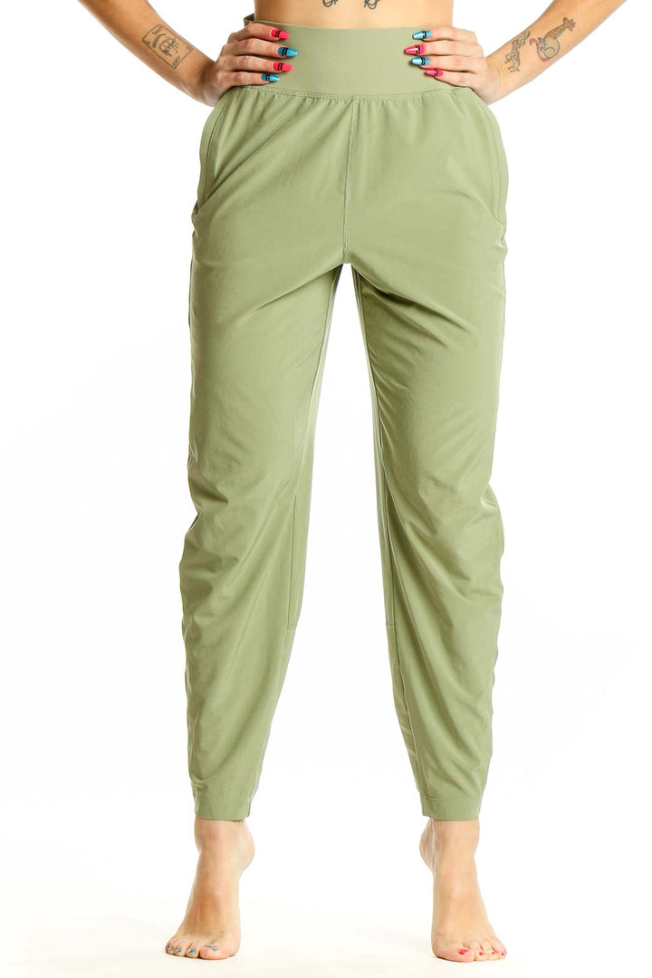 Front view of Athleta sage green high-waisted activewear pants