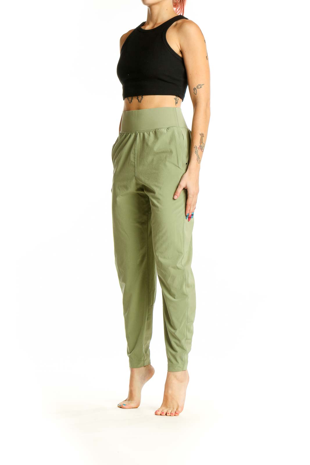 Front view of Athleta sage green high-waisted activewear pants