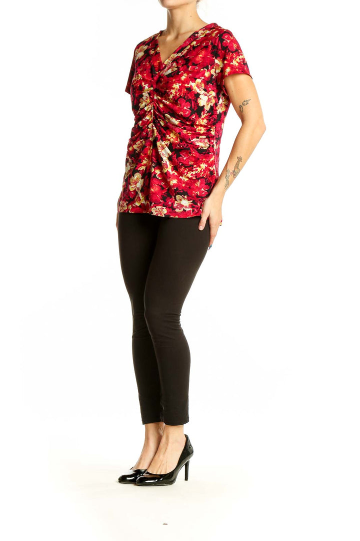 Front view of Alfani red floral ruched V-neck top