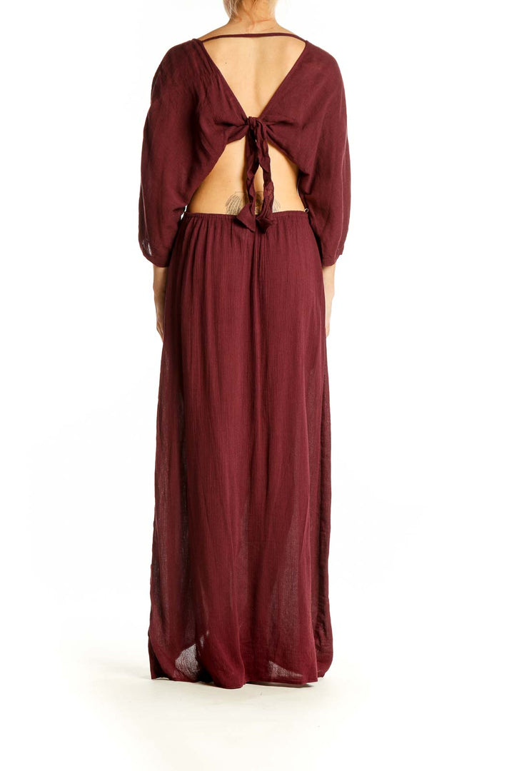 Side view of Sanctuary burgundy maxi dress showing flowy silhouette and high slit