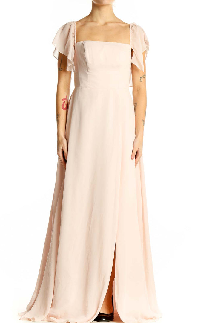 Front view of AZAZIE blush maxi dress with flutter sleeves and front slit