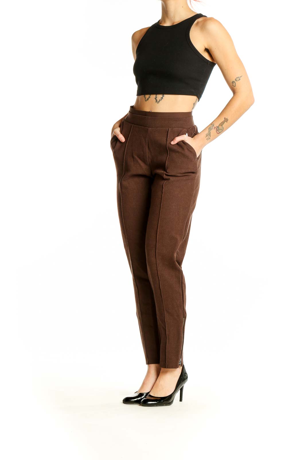 Front view of Athleta brown high-waisted pleated trousers