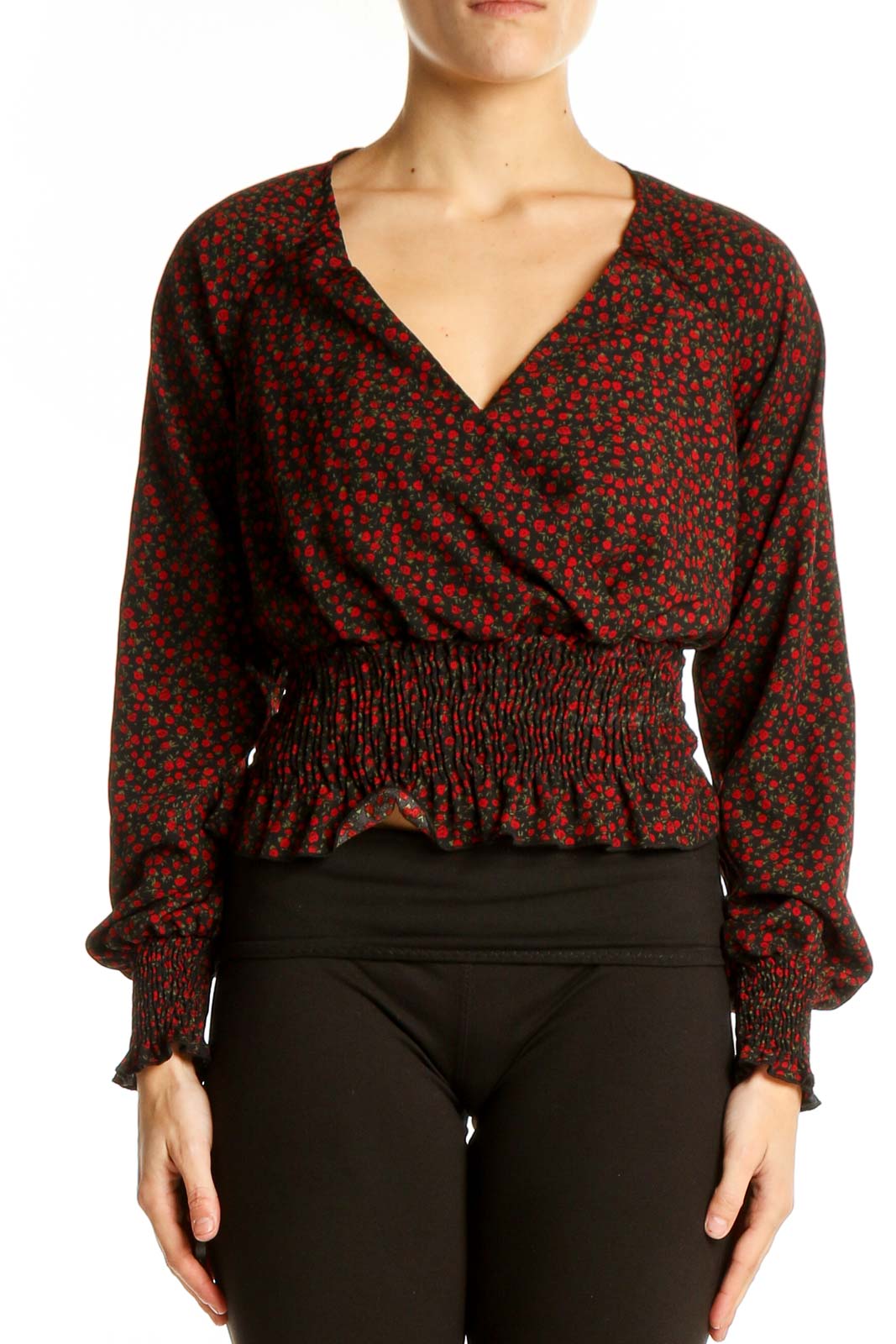 Front view of BP red floral cropped wrap top with V-neckline and smocked waist