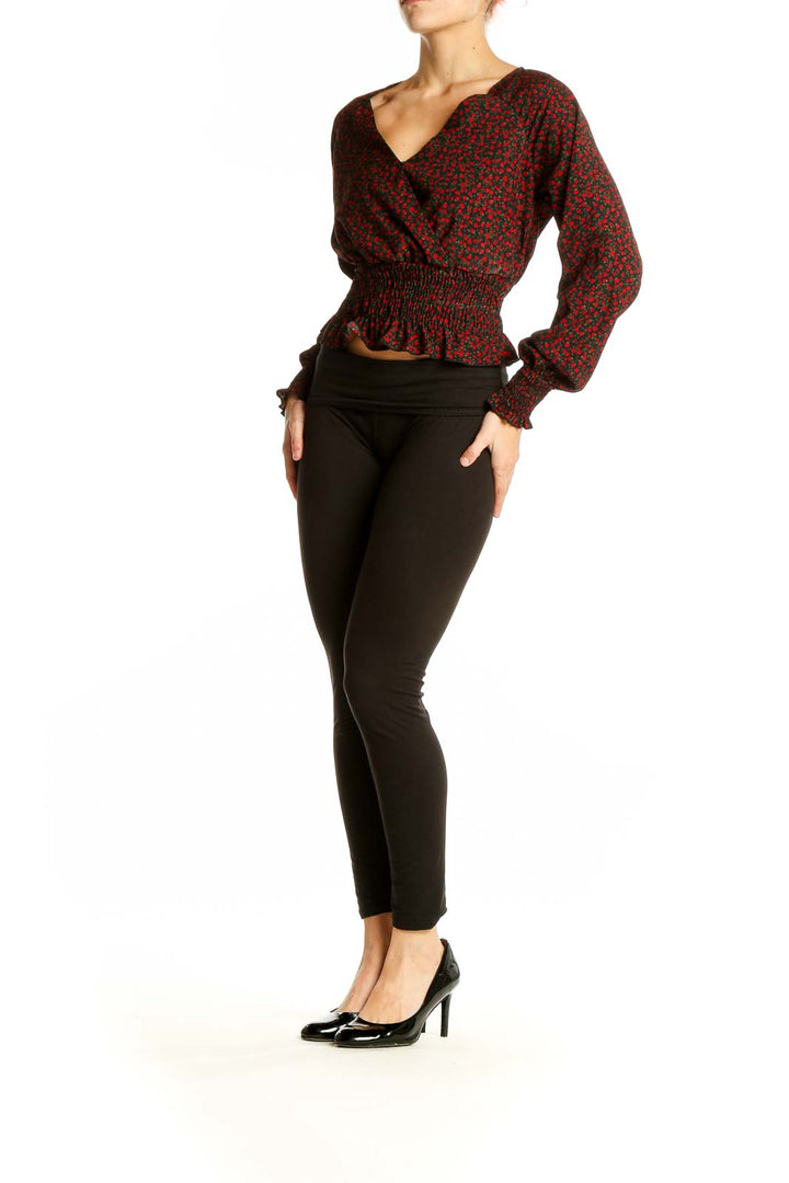 Front view of BP red floral cropped wrap top with V-neckline and smocked waist