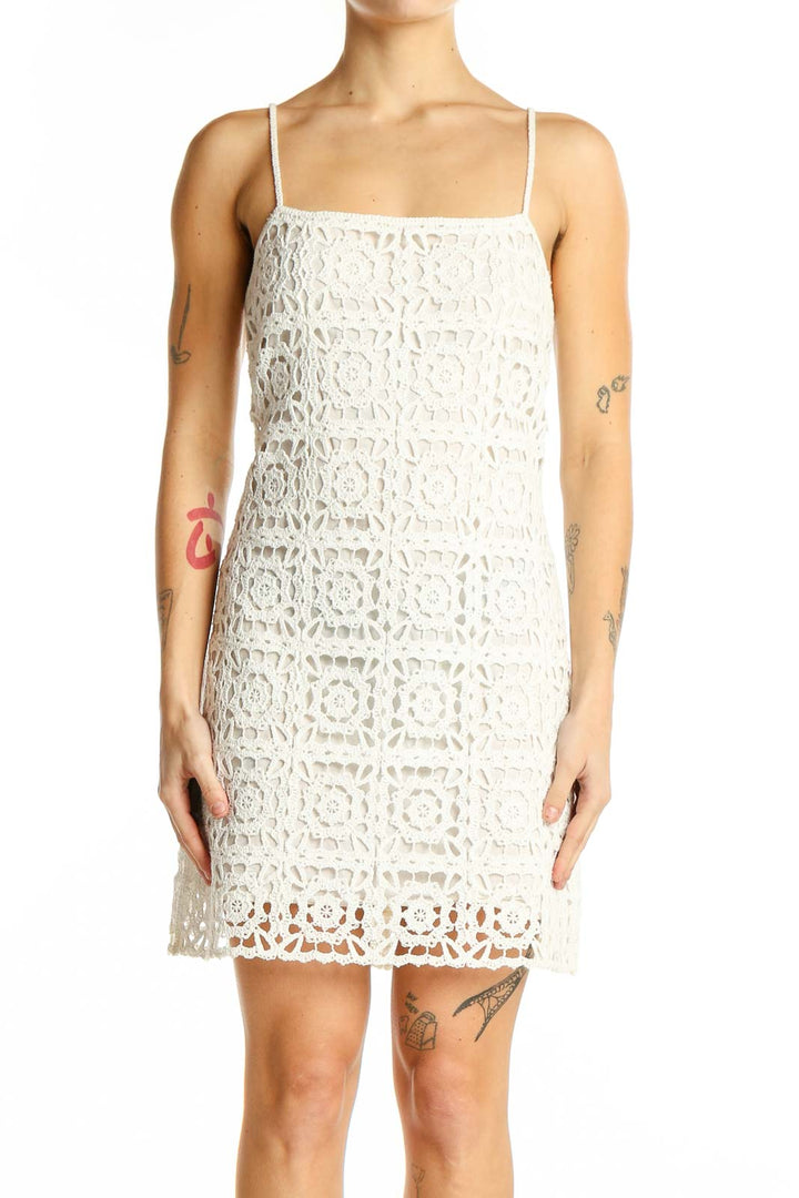 Front view of Zara white crochet lace mini dress with spaghetti straps