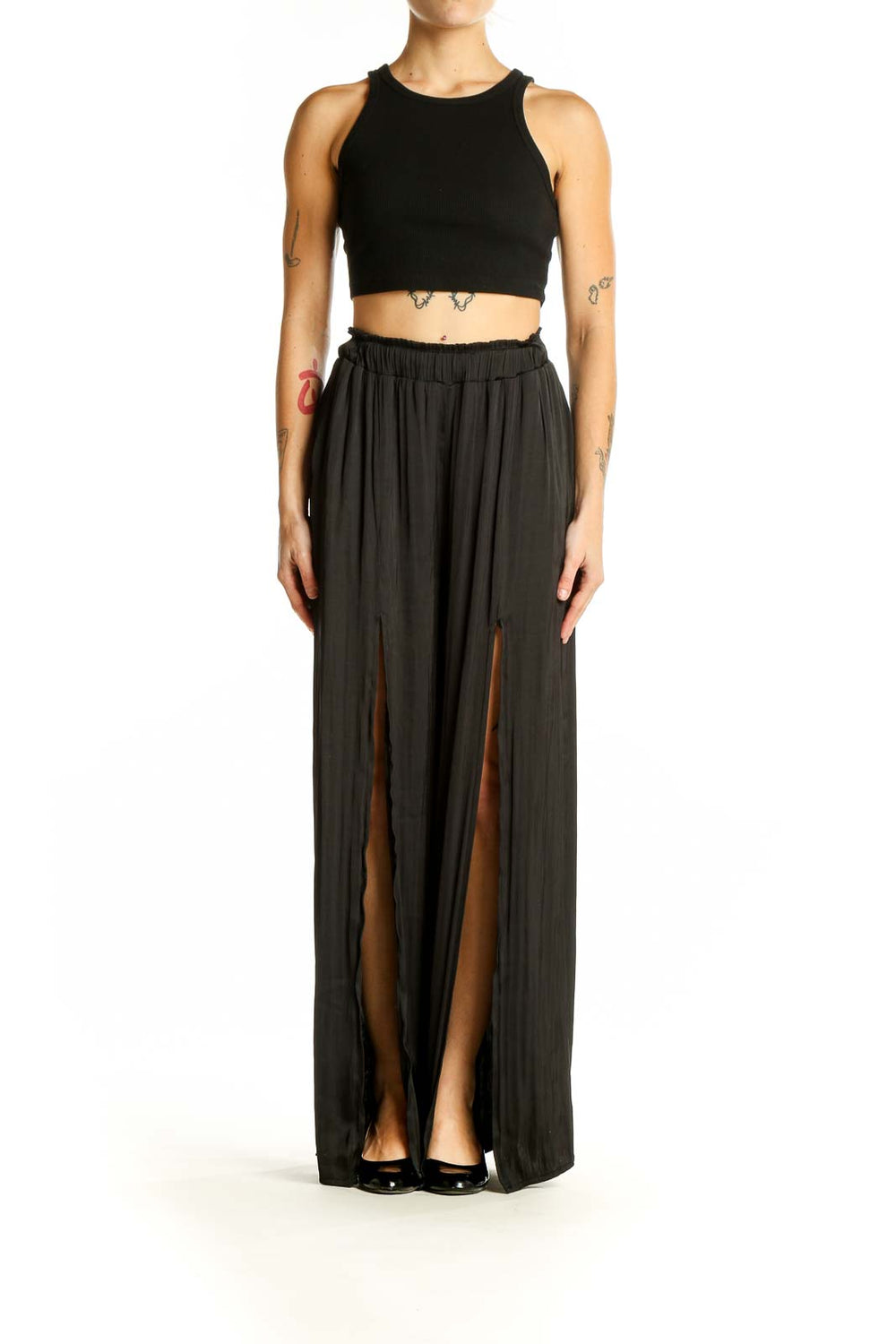 Front view of By Together black wide-leg pants with side slits