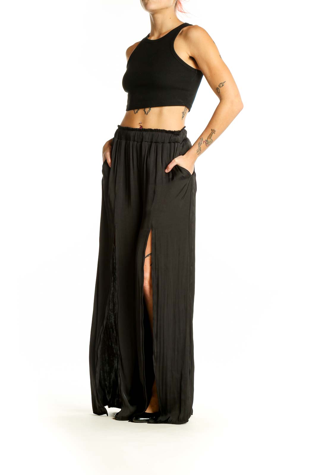 Front view of By Together black wide-leg pants with side slits