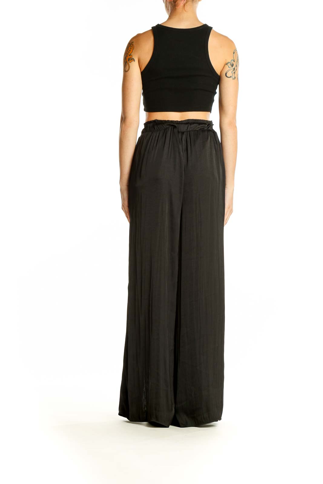 Side view of By Together black wide-leg pants showing dramatic side slits