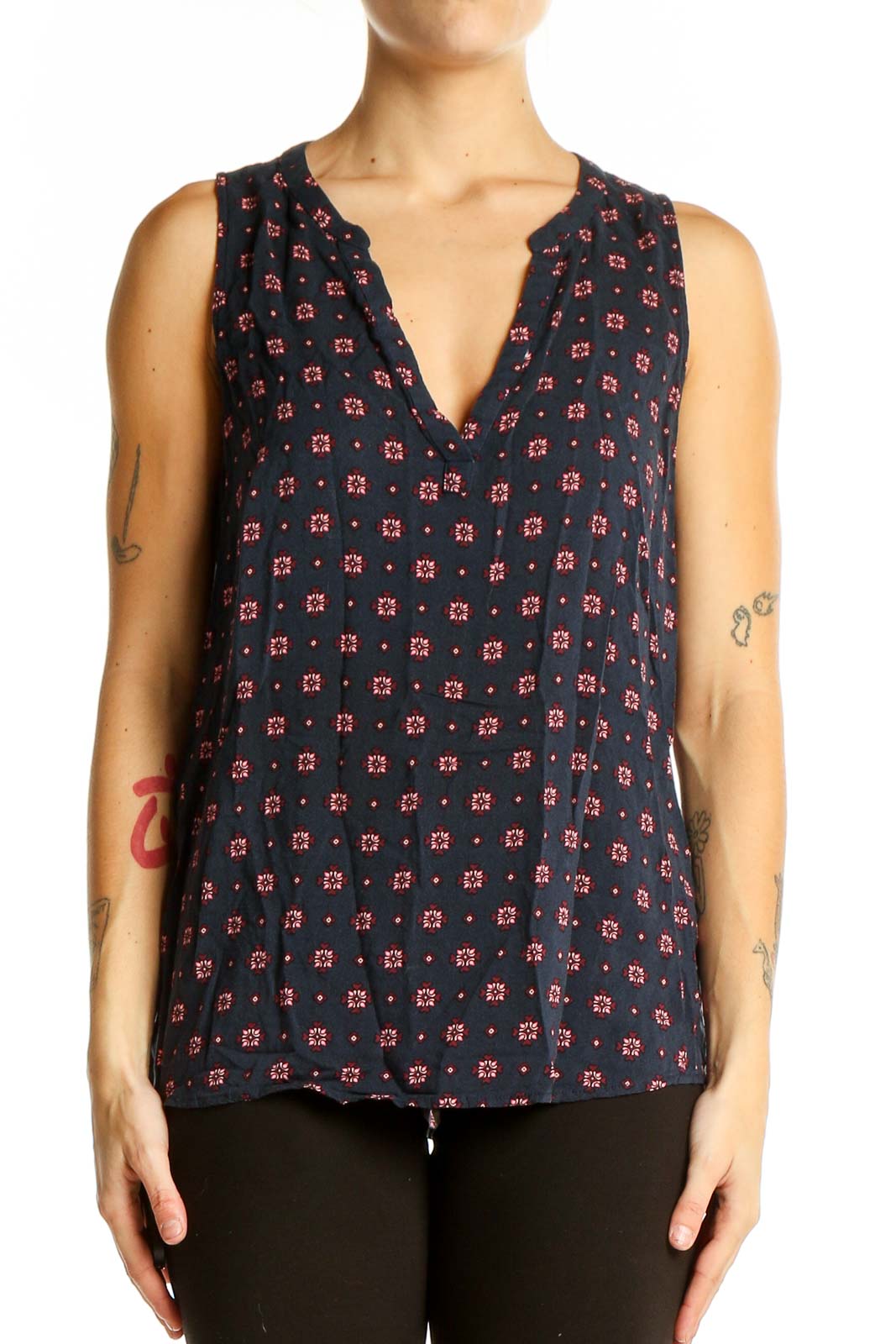 Front view of Gap navy sleeveless blouse with red and white floral print