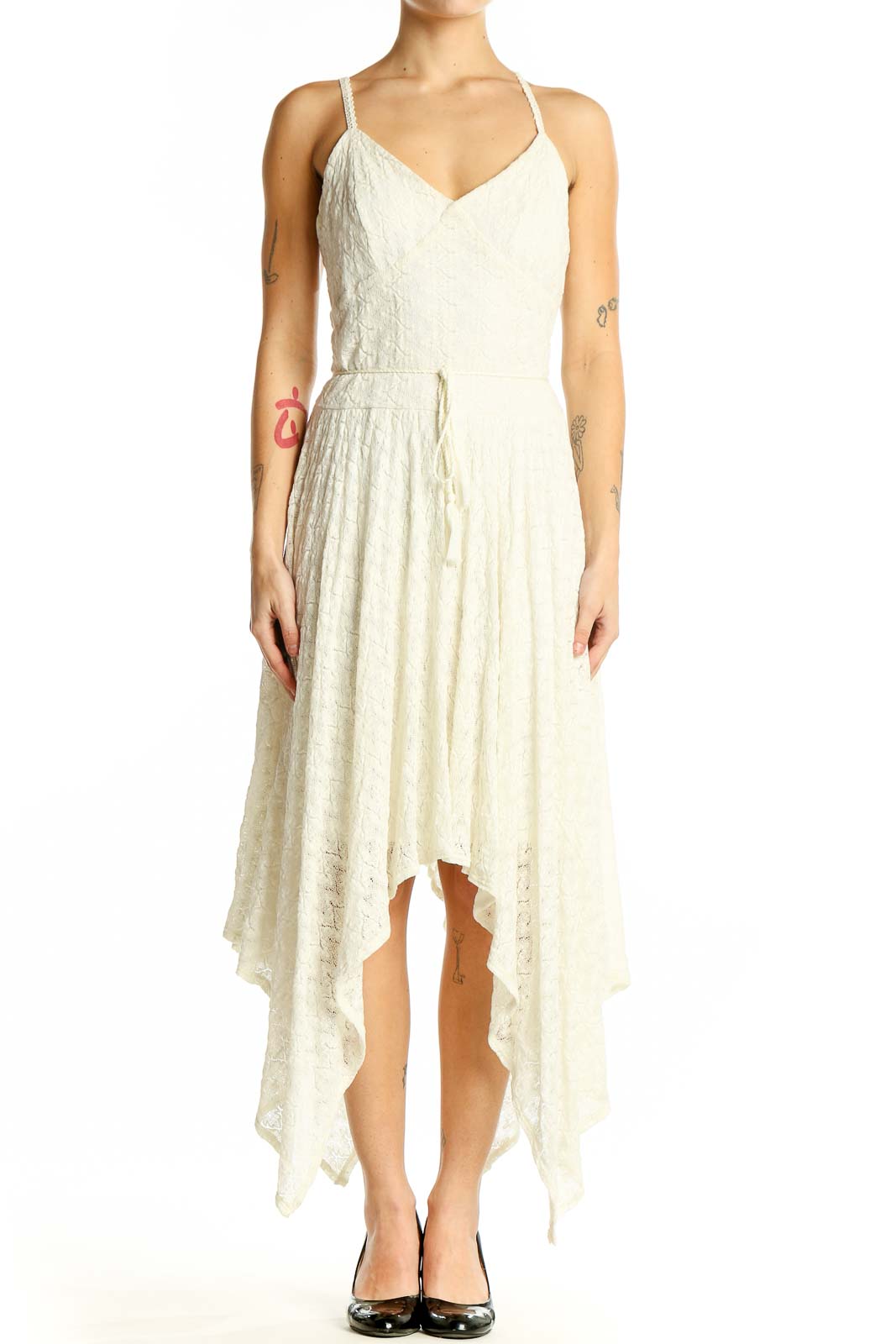 Front view of Bebe ivory lace maxi dress with handkerchief hem and spaghetti straps