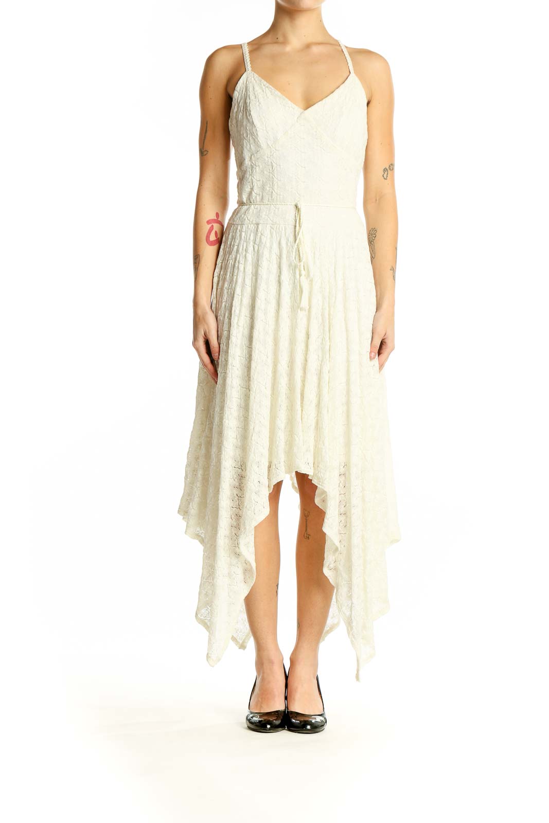 Front view of Bebe ivory lace maxi dress with handkerchief hem and spaghetti straps