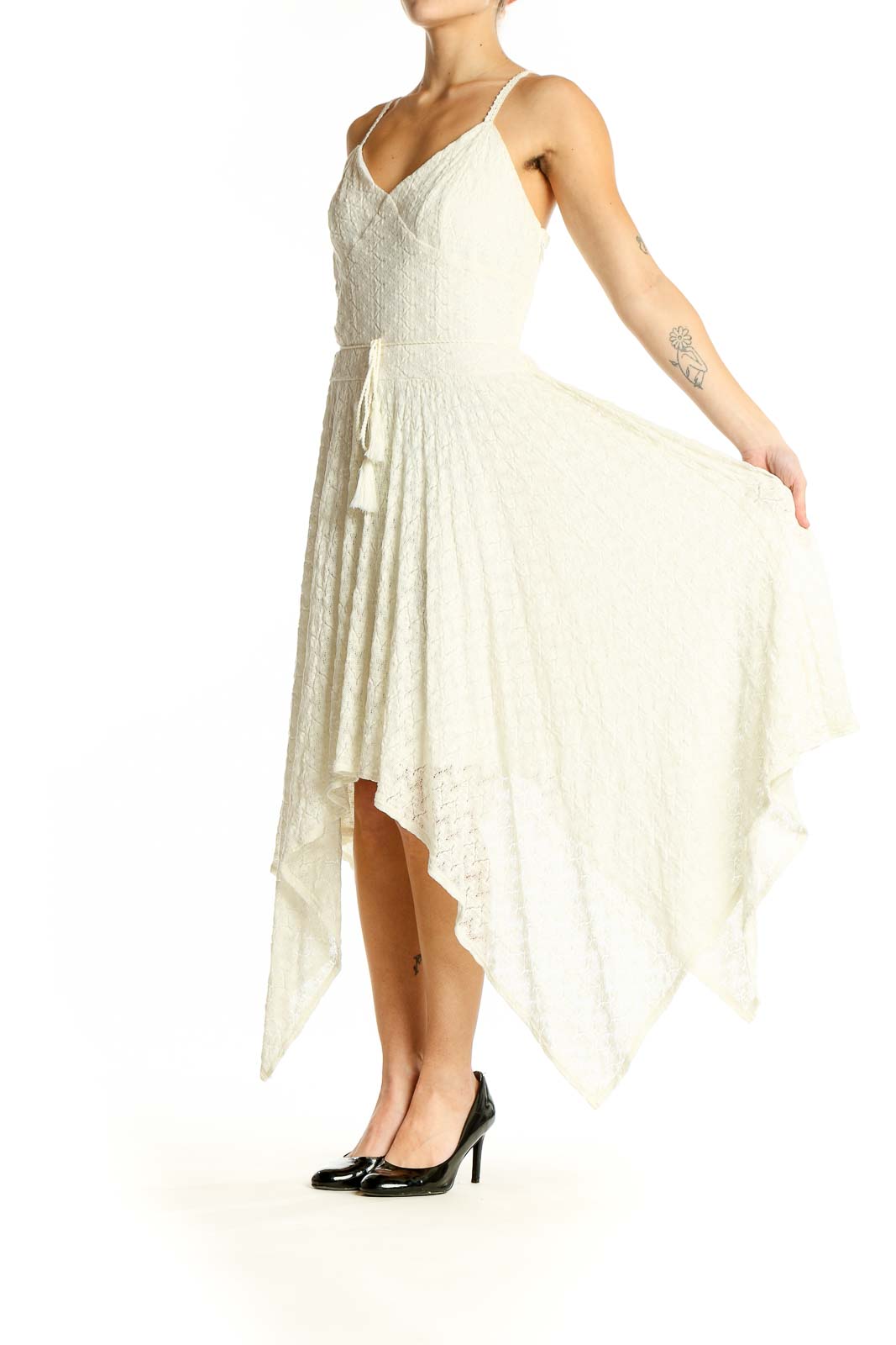 Front view of Bebe ivory lace maxi dress with handkerchief hem and spaghetti straps