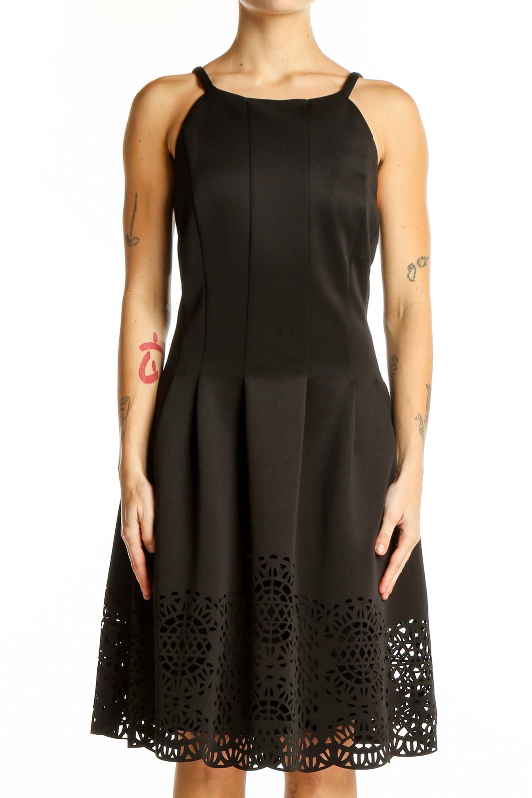 Front view of Vince Camuto black fit and flare dress with laser-cut hem