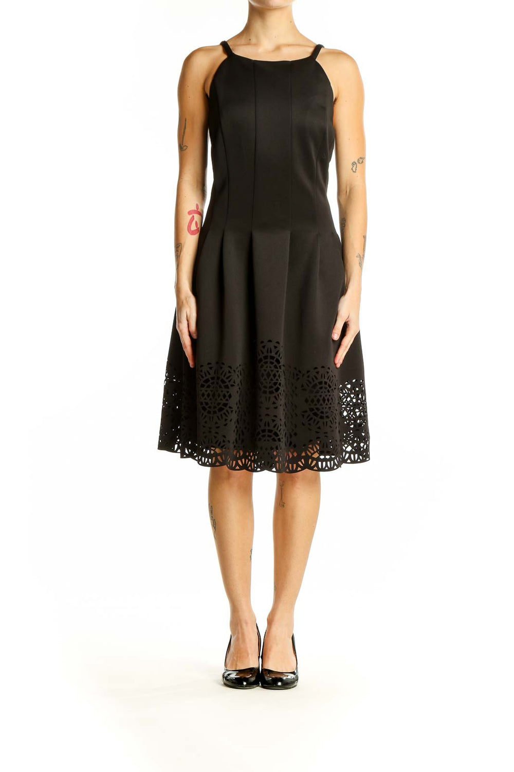 Front view of Vince Camuto black fit and flare dress with laser-cut hem