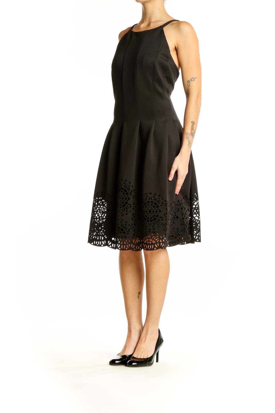 Front view of Vince Camuto black fit and flare dress with laser-cut hem