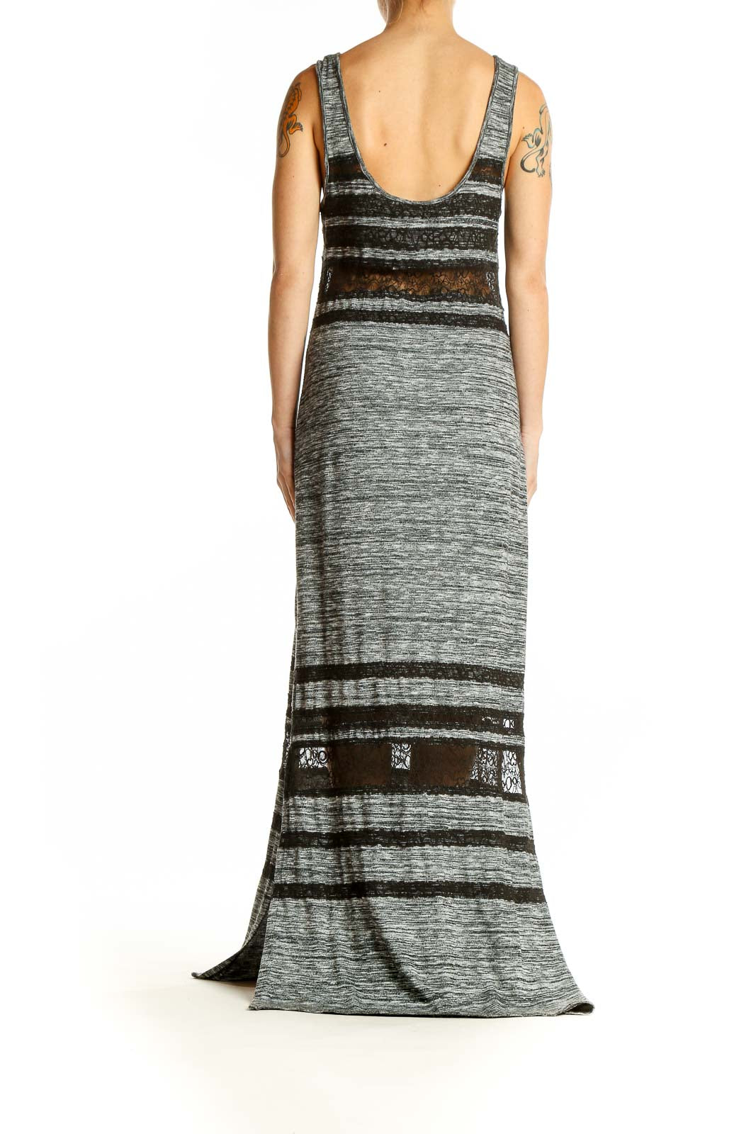 Side view of Free People gray striped maxi dress showing full length and lace details