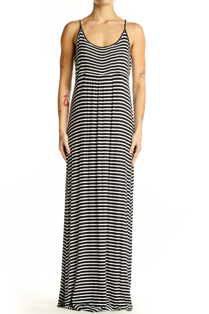 Front view of Calvin Klein black and white striped maxi dress with spaghetti straps