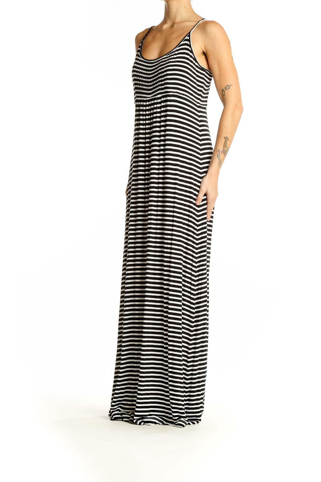 Front view of Calvin Klein black and white striped maxi dress with spaghetti straps