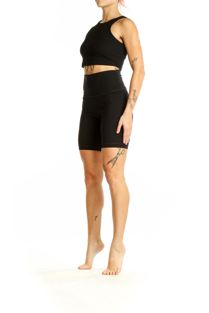 Front view of black high-waisted biker shorts from Everlane