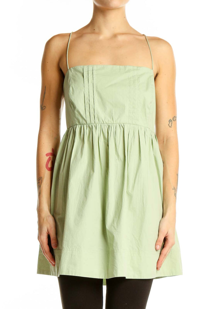 Front view of Maeve sage green cotton babydoll top with spaghetti straps