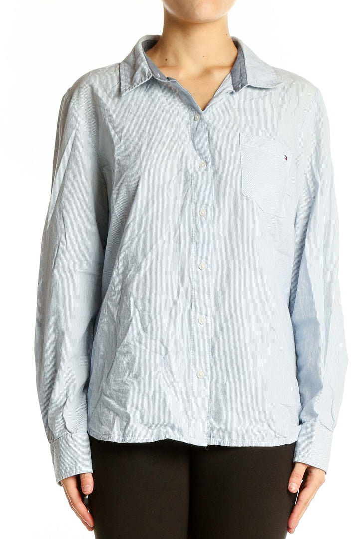 Front view of Tommy Hilfiger light blue striped cotton button-down shirt