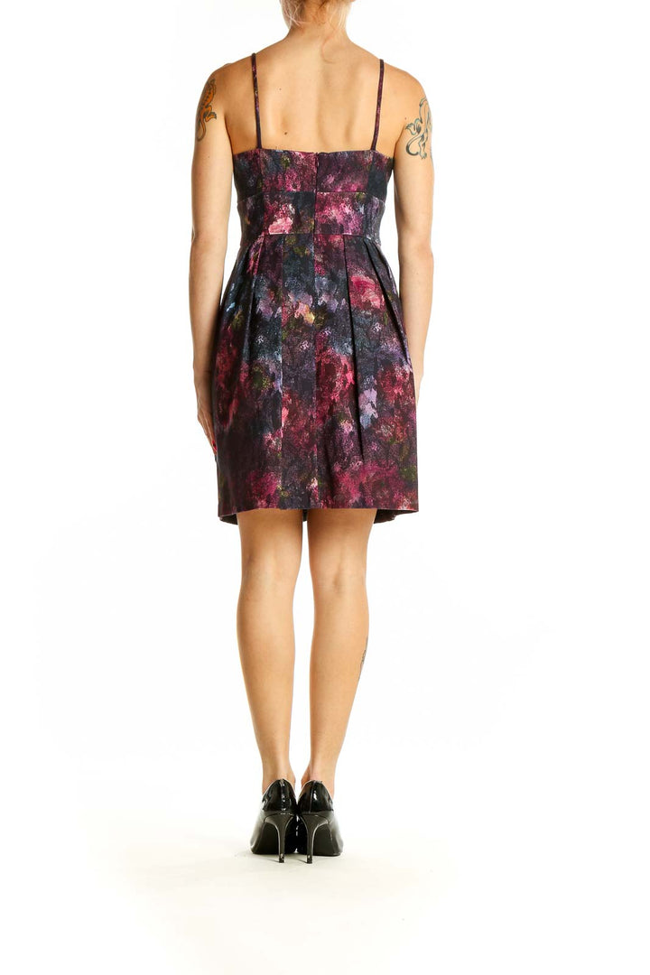 Back view of Nanette Lepore purple floral print cocktail dress showing spaghetti straps and A-line silhouette