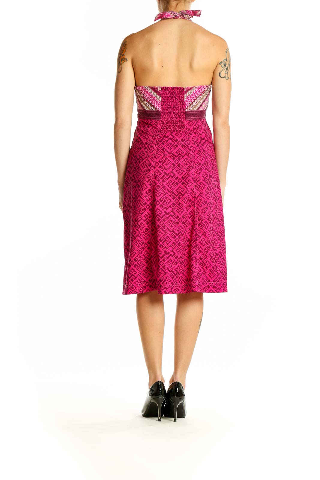 Side view of pink Athleta halter dress showing pattern and silhouette