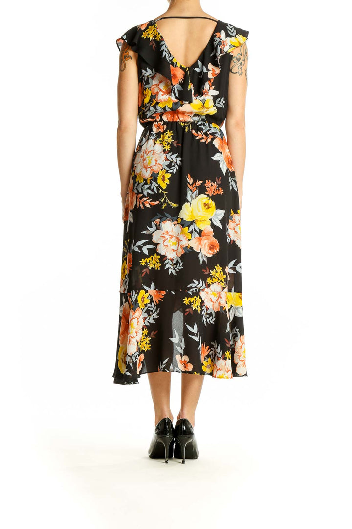 Back view of Socialite black floral wrap midi dress showing high-low hemline