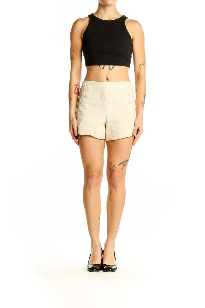 Front view of LOFT cream cotton shorts with button-front detail