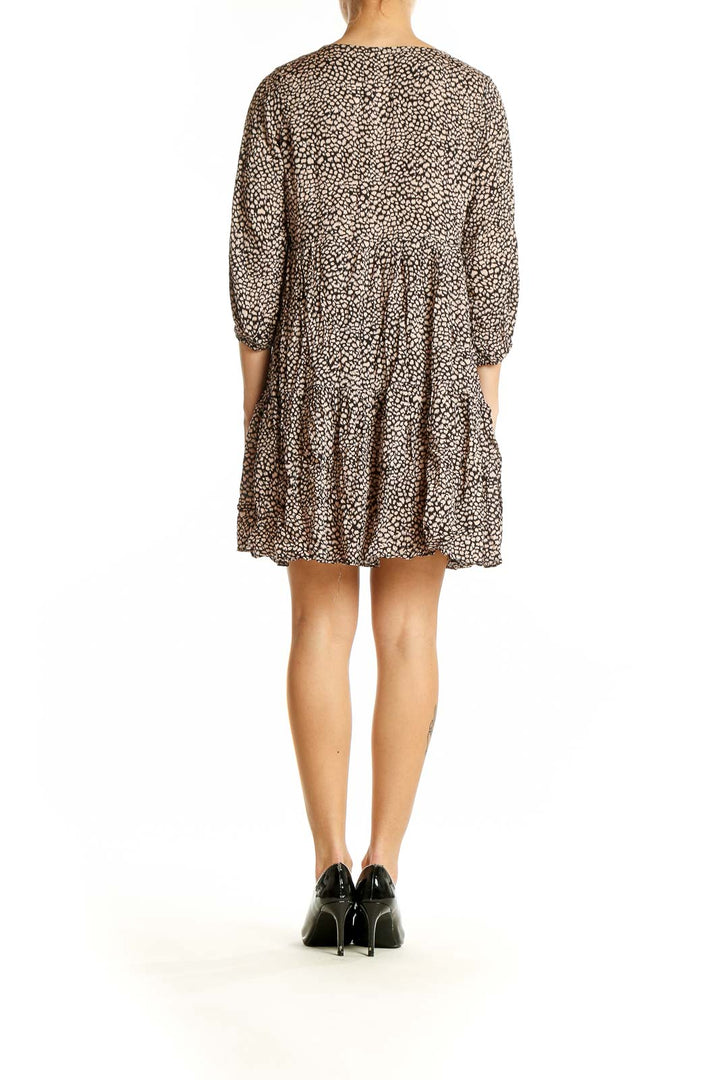 Side view of Millibon brown leopard print tiered mini dress showing flowy silhouette