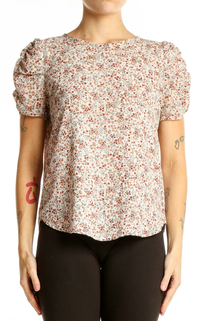 Front view of LOFT cream floral puff sleeve blouse