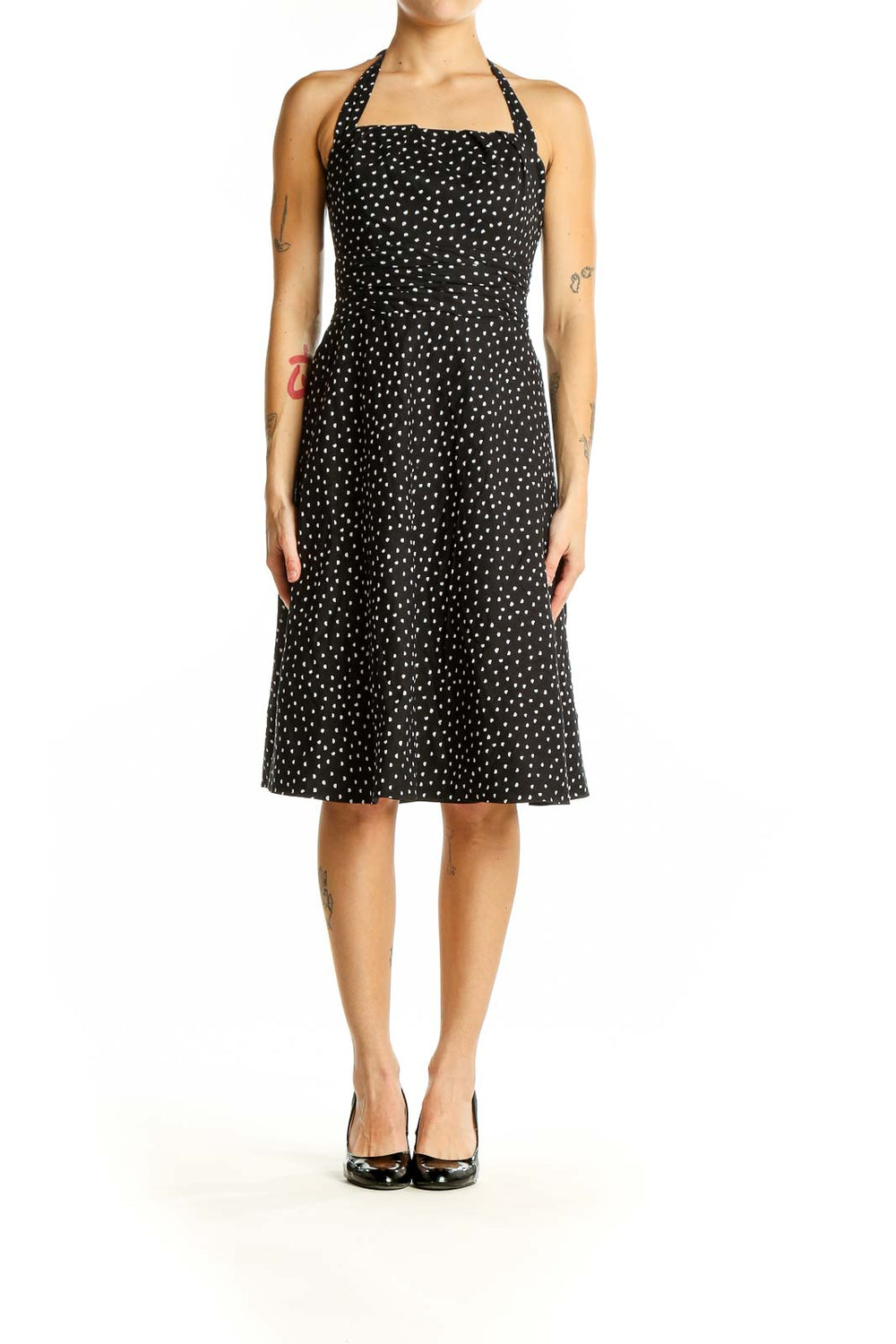 Front view of White House Black Market black polka dot halter dress