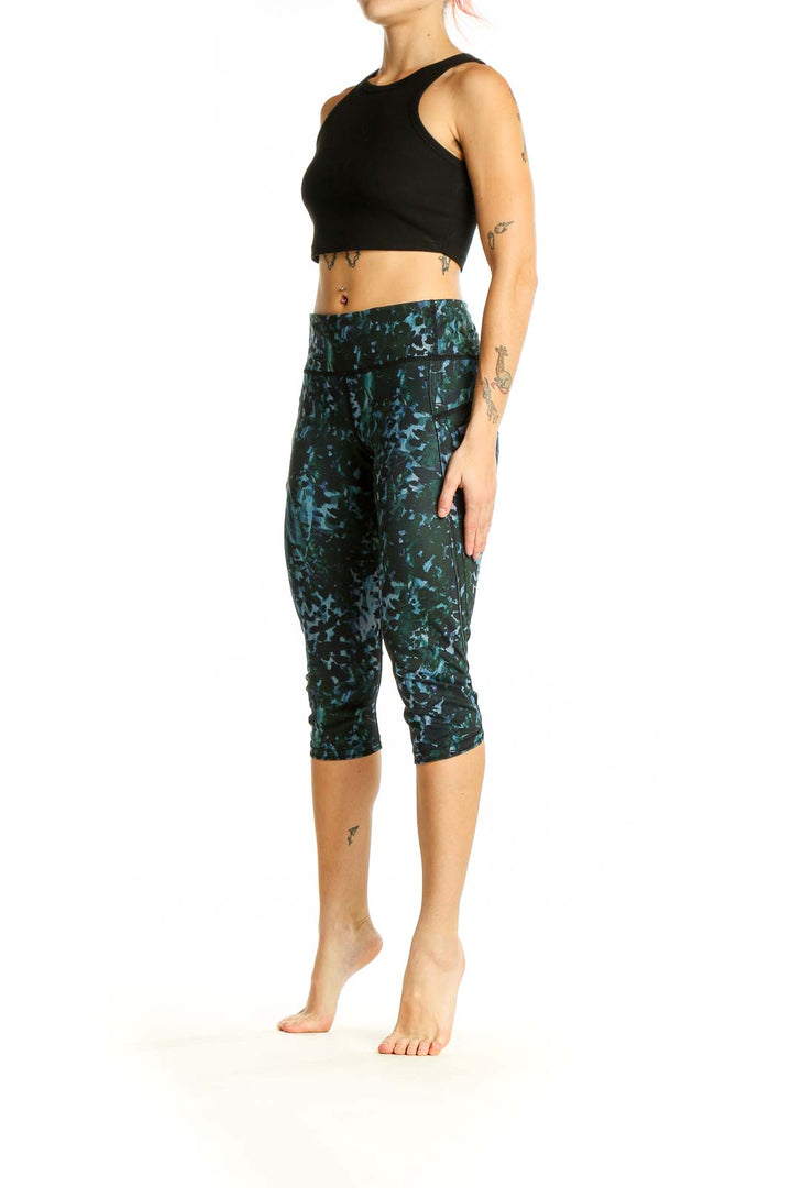 Front view of Lululemon green patterned capri leggings