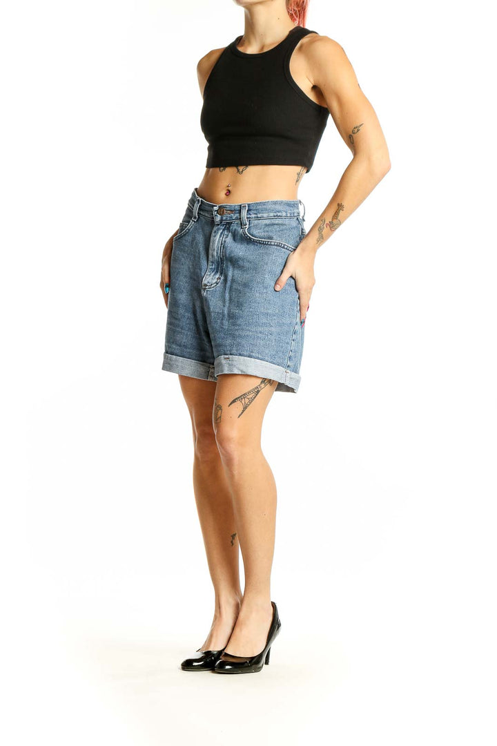 Front view of Riders by Lee light blue high-waisted denim shorts with cuffed hem