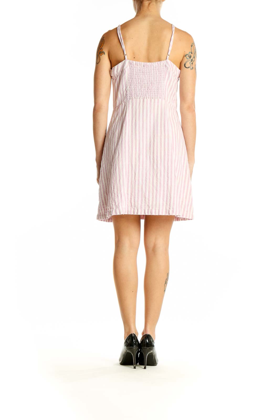 Side view of Lulu's pink striped button-front mini dress showing pocket detail