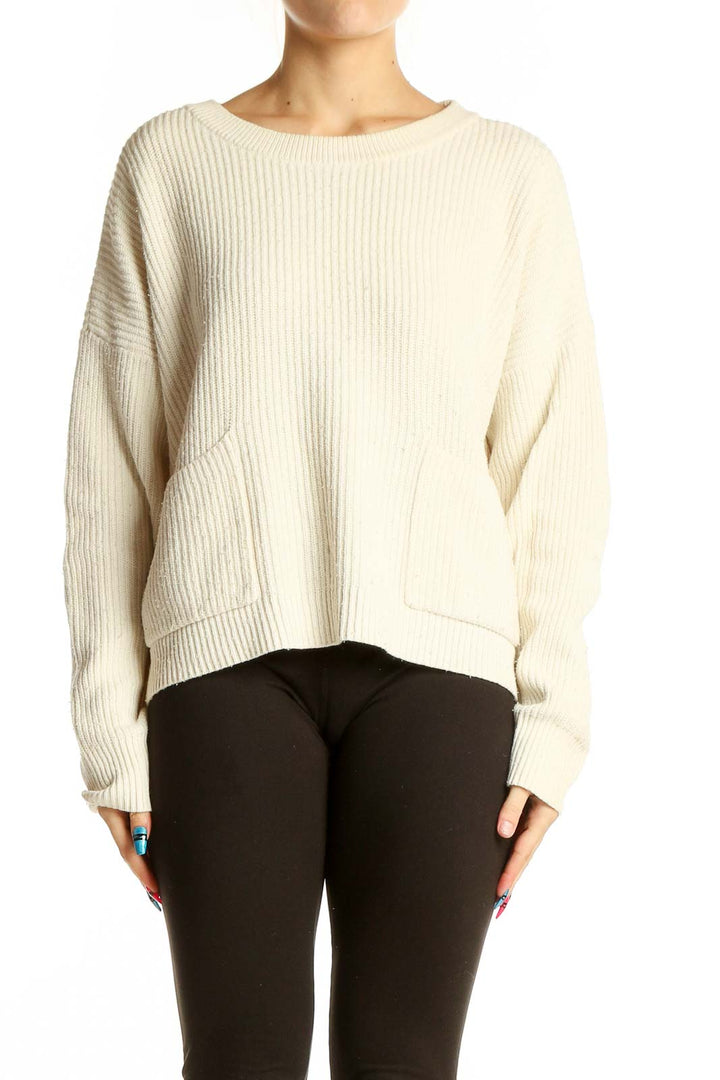 Front view of cream ribbed knit sweater with pockets from Madewell