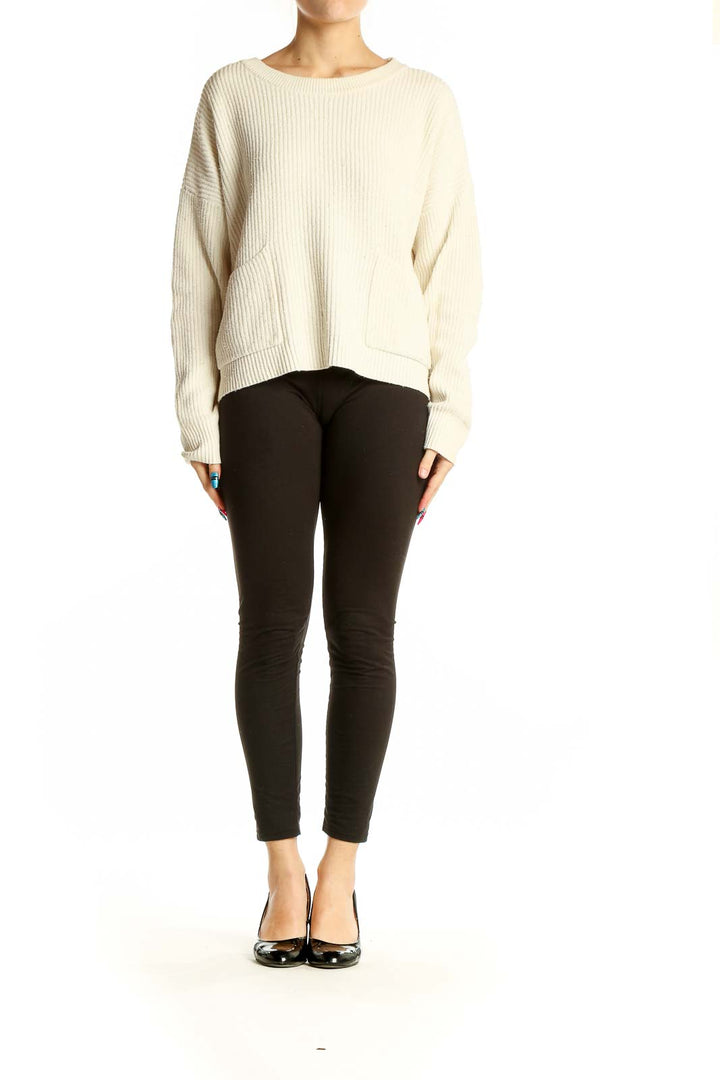 Front view of cream ribbed knit sweater with pockets from Madewell