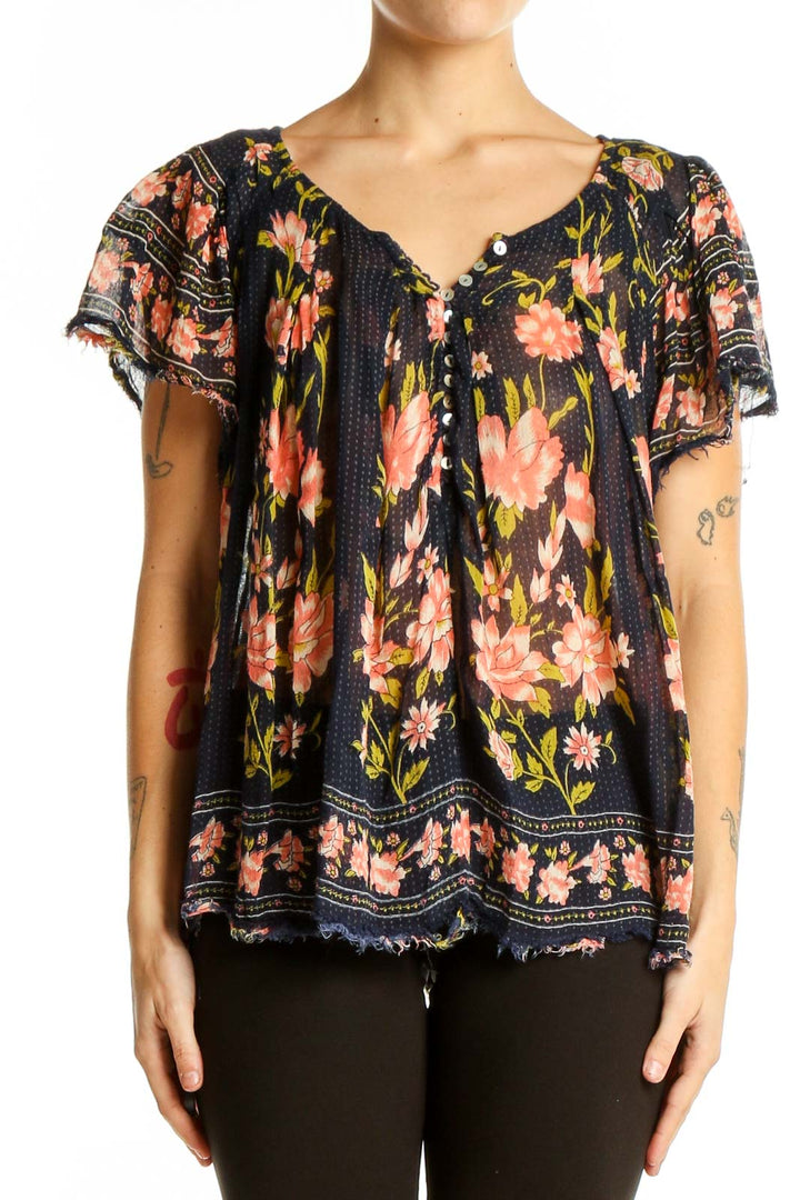 Front view of Free People navy floral peasant top with flutter sleeves