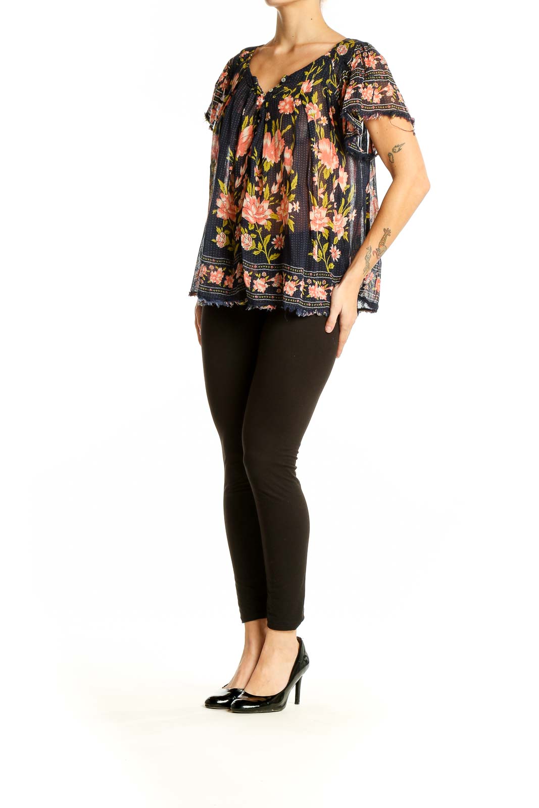 Front view of Free People navy floral peasant top with flutter sleeves